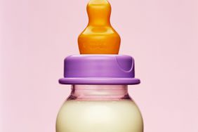 An image of a baby bottle with milk in it.