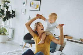 An image of a mother playing with her son.