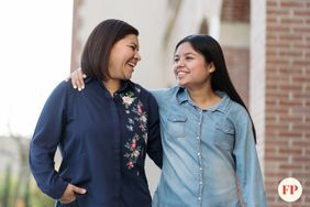 Tween Girl walking and talking with her mom 