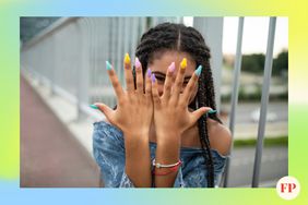 Tween girl shows off her colorful nails 