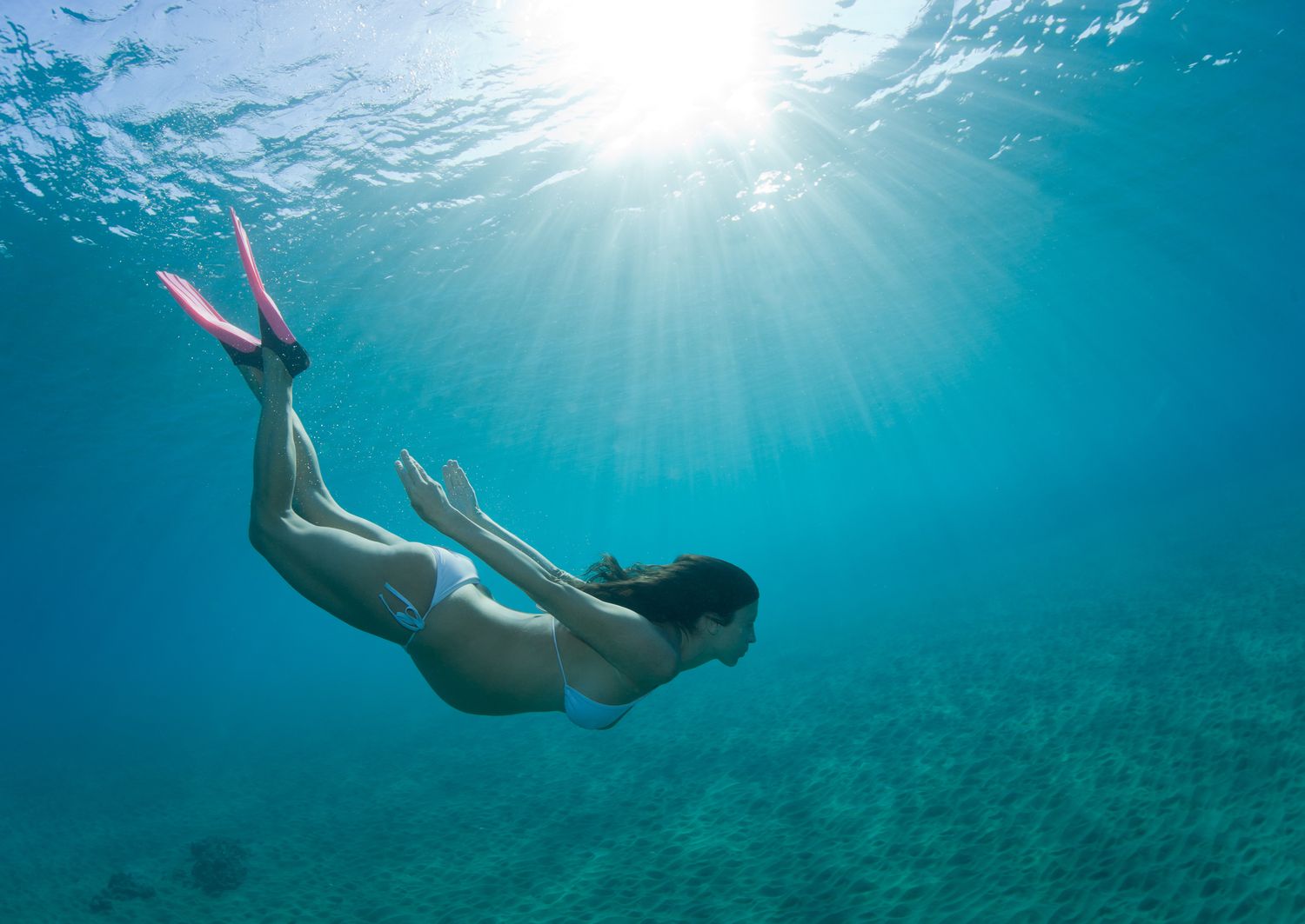 Woman pregnant free diving underwater