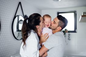 Mom and dad with happy baby