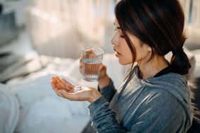 woman taking medication