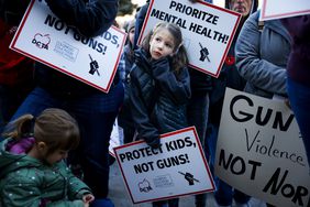 child at a protest to end gun violence