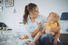 An image of a woman yelling with a crying baby.