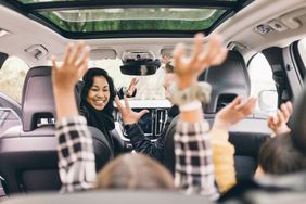 family in a car playing games