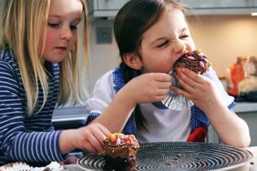 kid eating cupcakes