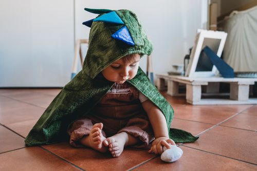 baby boy dressed as dragon