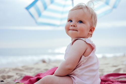 Girl sitting on the beach