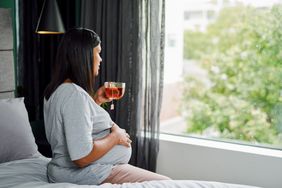 pregnant person drinking tea