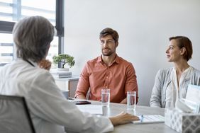 Couple talking to a doctor about fertility treatments