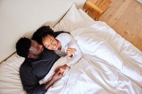 couple in bed cuddling