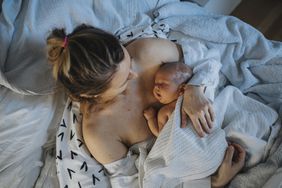 Baby sleeping on mother's chest