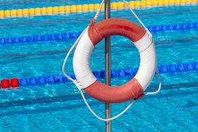 Close up of rescue tires against swimming pool.