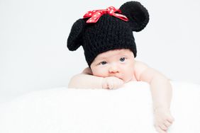 baby wearing crocheted Minnie Mouse ears 