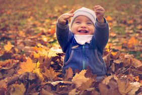 baby in leaves