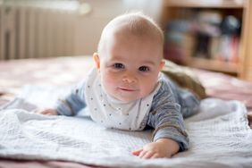 baby boy doing tummy time on blanket