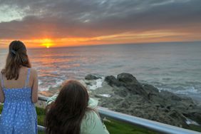 Two girls watching the sunset