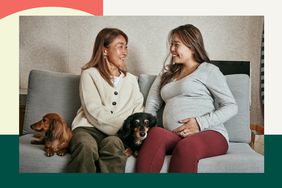 Mom and pregnant daughter sitting on the couch