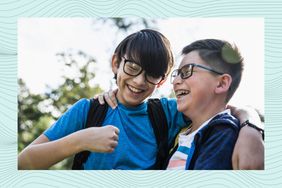 Tween boys laughing outdoors