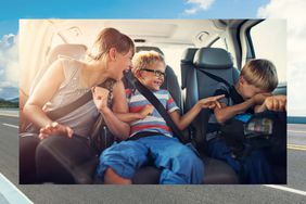 Three children laughing in the backseat during a roadtrip 