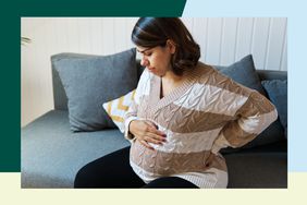 Pregnant woman in pain, holding her belly and back 