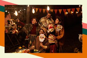 A family of five poses for a Dia de los Muertos selfie