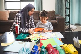 Parent and child doing creative activities together 