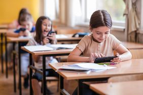 Children using their phones at school