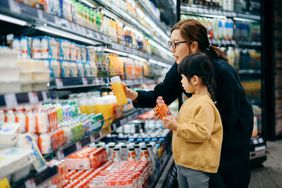 Mother and daughter shop at the supermarket