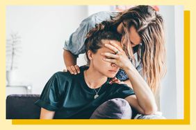 woman comforting another woman who appears distressed