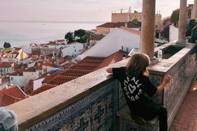 A child on vacation overlooking the city 