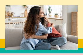 Mom and tween hugging on couch after a conflict. 