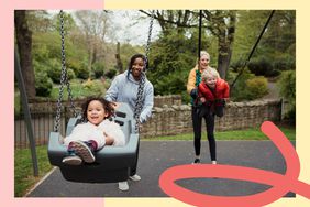 Two moms pushing their kids on swings at the park 