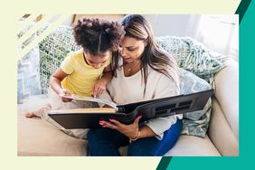 Mom sharing a photo album with her daughter 