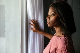 Woman looking out a window