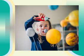 Child playing with rocket ship