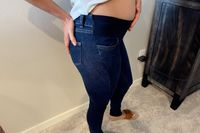 A pregnant person wearing the Signature by Levi Strauss & Co. Gold Label Maternity Baby Bump Skinny Jeans