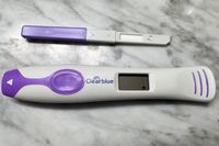 ClearBlue Connected Ovulation Test stick and reader on a marble counter