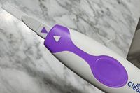 ClearBlue Connected Ovulation Test stick and reader on a marble counter