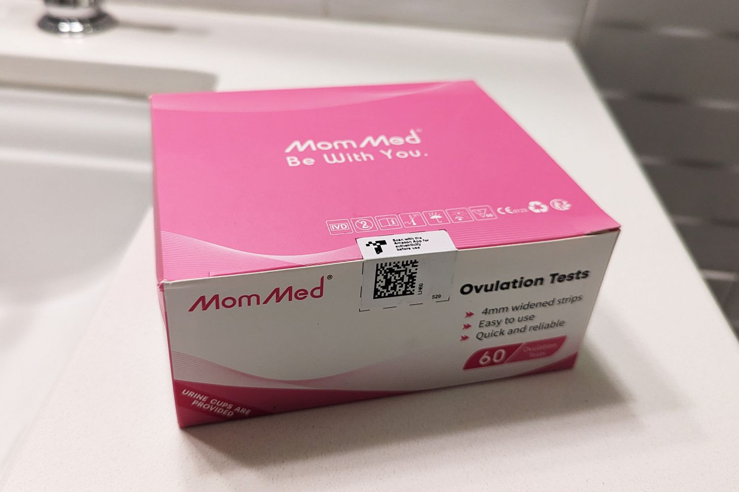 MomMed Ovulation Test Strip box sitting on a counter