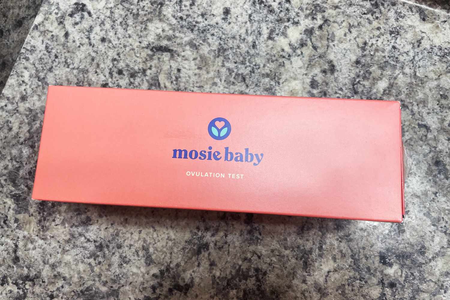 Mosie Baby Predict Ovulation Kit box on a granite counter