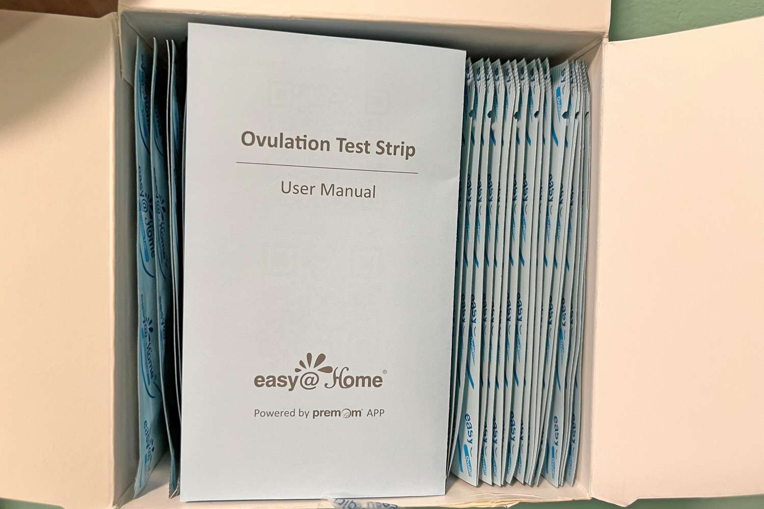 A box full of Premom Easy@Home Ovulation and Pregnancy Test Strips