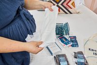 A person stretches out the extra-long postpartum pads from the Nyssa 6-piece Deluxe Postpartum Recovery Set