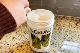 Person scooping out Needed Collagen Protein Powder