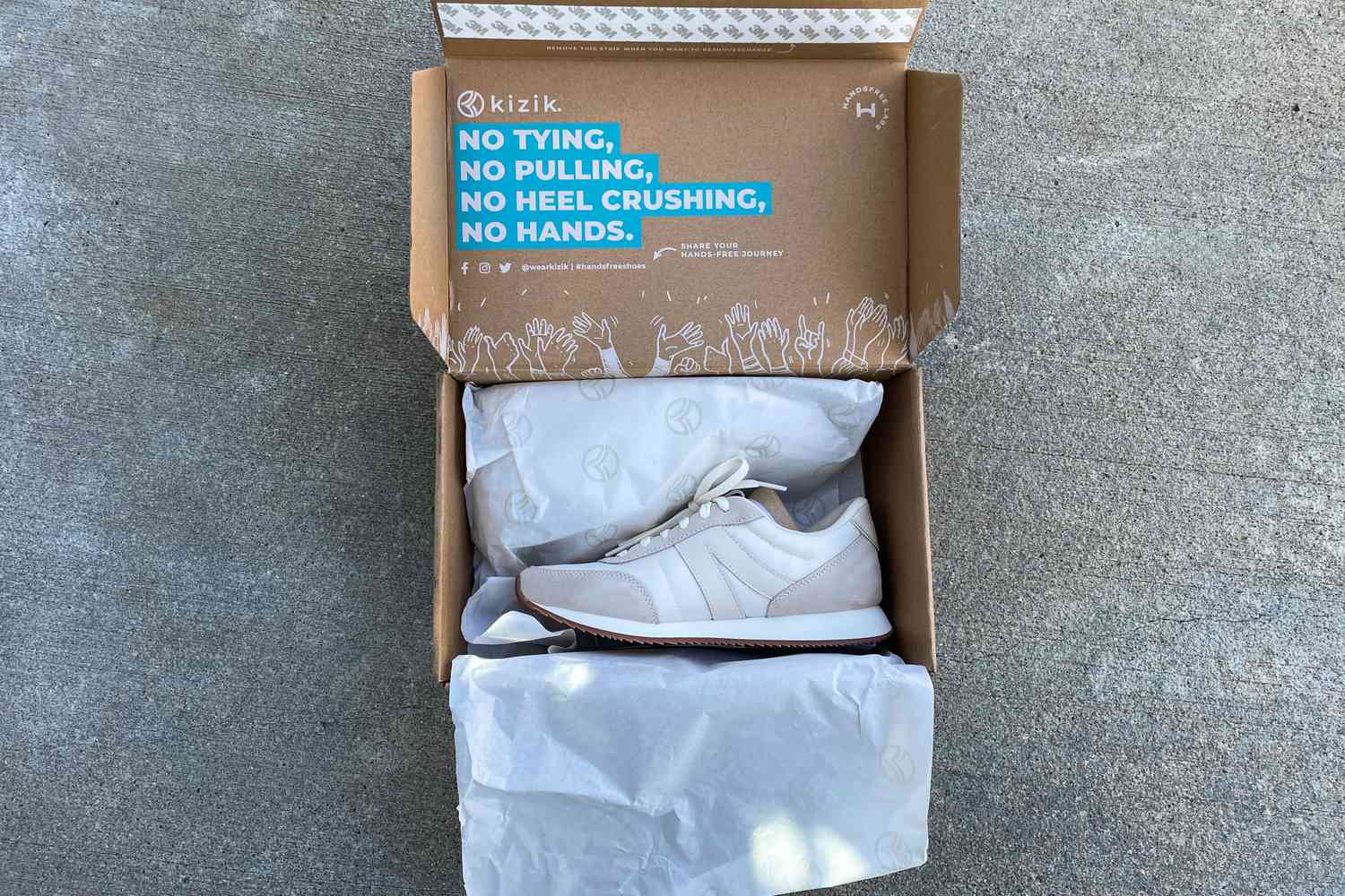 A pair of Kizik Milan Slip-On Sneaker in the box before use