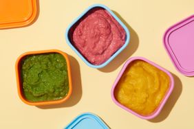 colorful tupperware of puree 