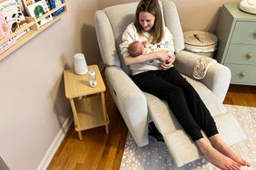 A person and baby seated in the Pottery Barn Taylor Recliner