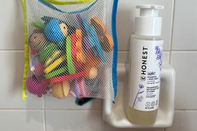 Close up of The Honest Company Nourish Shampoo + Body Wash and bath toys