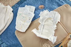 The Huggies Overnites Nighttime Baby Diapers on a changing mat